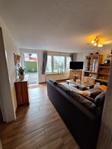 Ferienwohnung in Börgerende - Bull - Wohnzimmer zur Terrasse hinaus